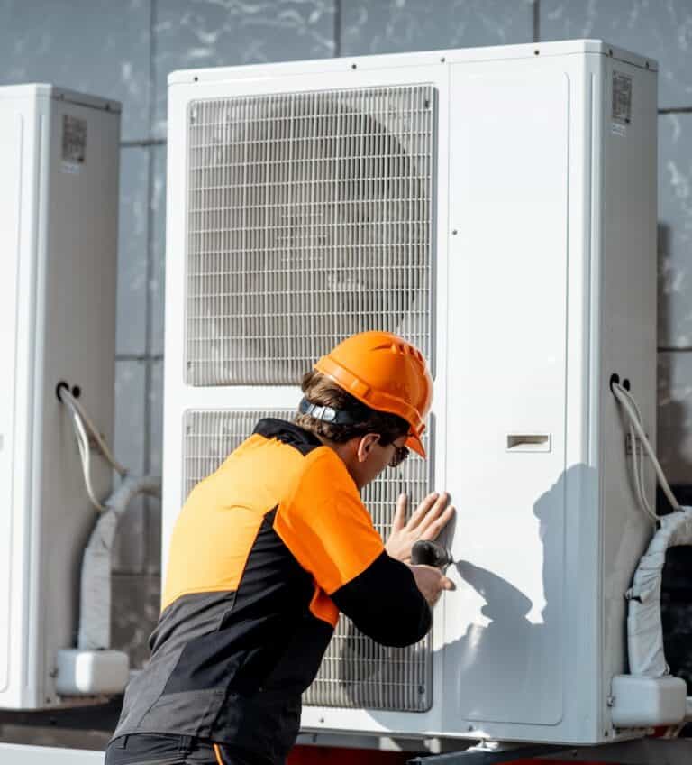 workman installing outdoor unit of the air conditioner 2